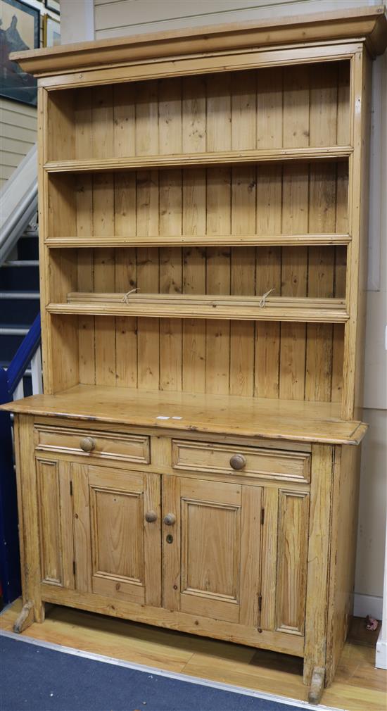 A stripped pine kitchen dresser W.133cm